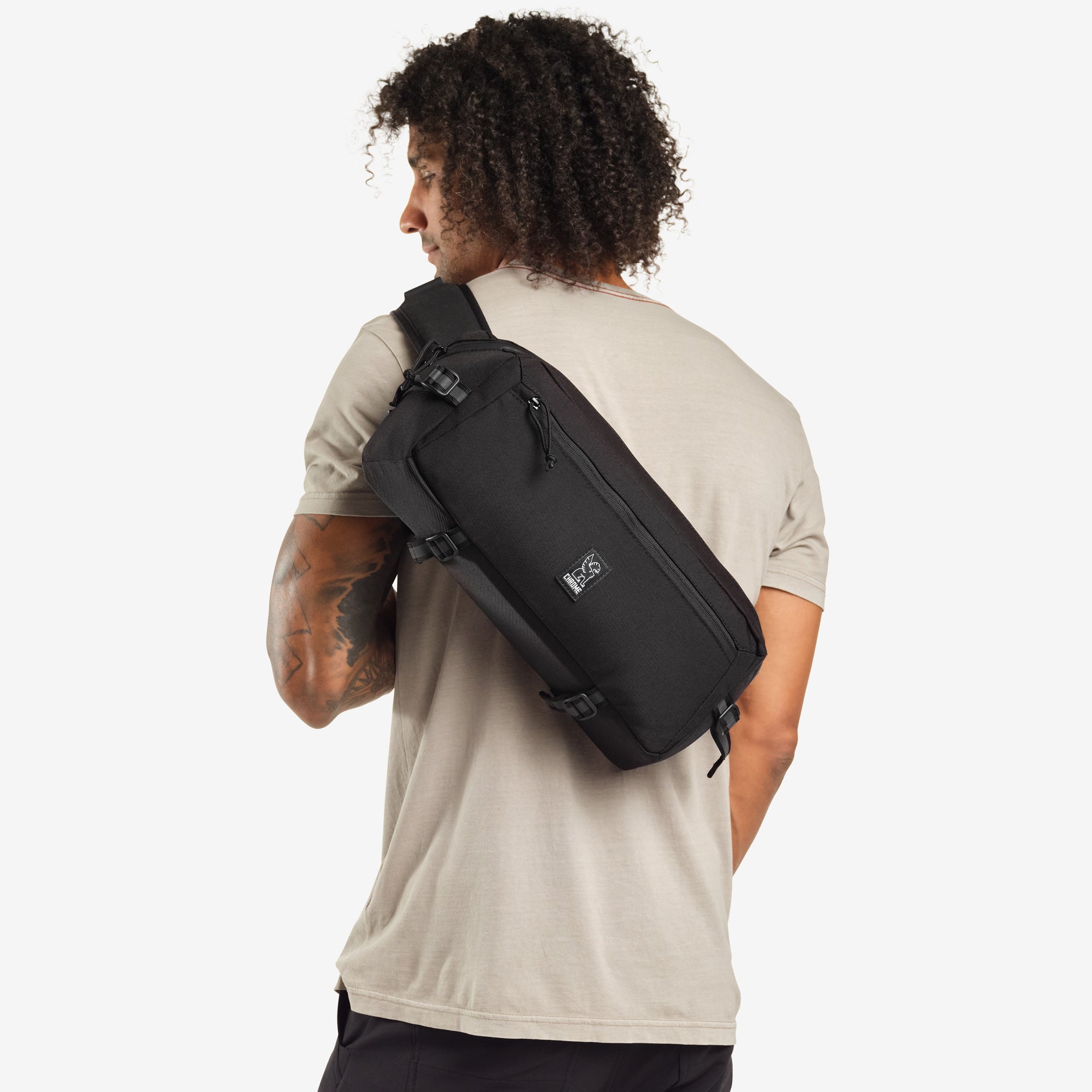 9L Kadet Sling in black shown on a person #color_black